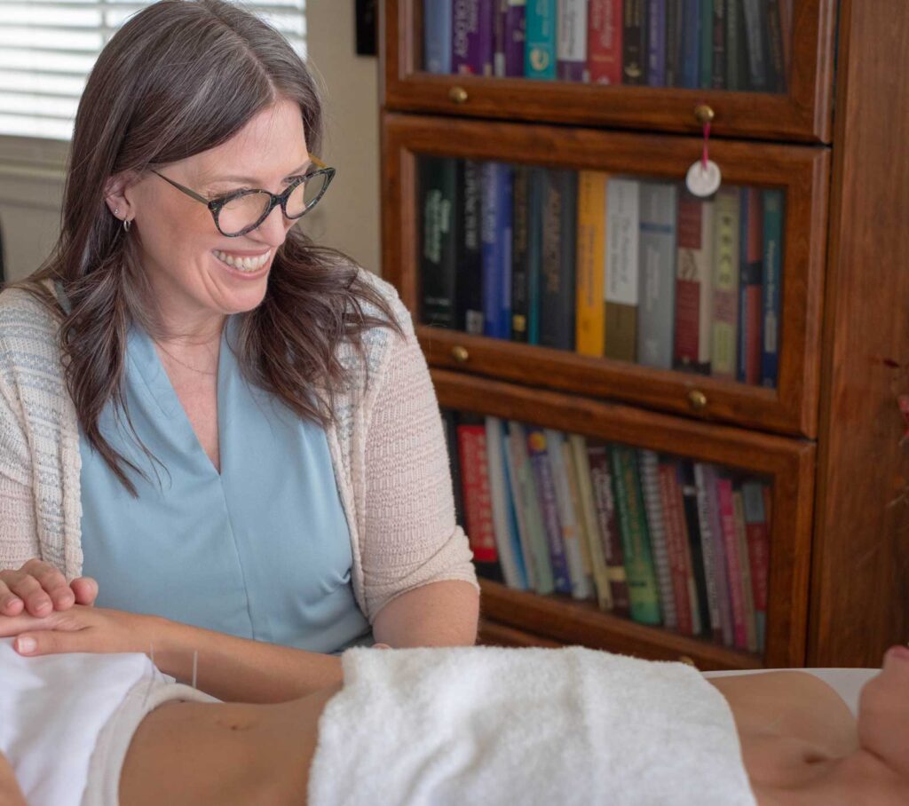 maren with patient during treatment | Acupuncture for PCOS in Boulder & Longmont