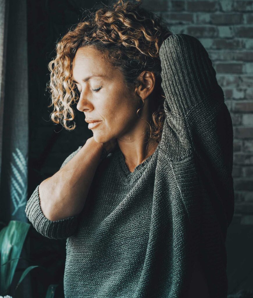 Woman stressed going through menopause symptoms Acupuncture for Menopause & Perimenopause in Boulder & Longmont