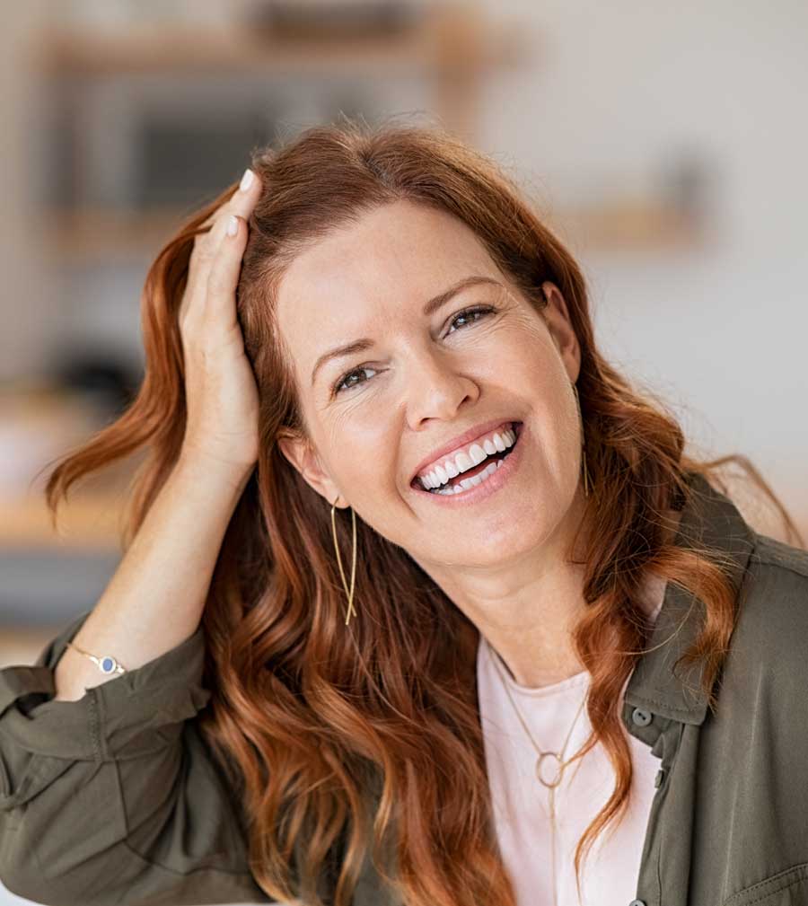 Hormone Evaluation | Happy woman smiling | Acupuncture for Hormone Balance in Boulder & Longmont